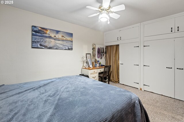 1842 NW Dogwood St, Roseburg, OR 97471 - bedroom featuring light carpet, multiple closets, and a ceiling fan