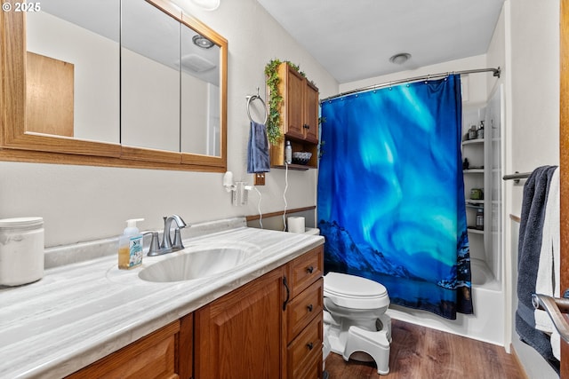 1842 NW Dogwood St, Roseburg, OR 97471 - full bath with toilet, vanity, wood finished floors, and shower / bath combo