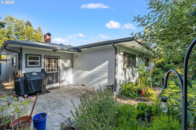 1842 NW Dogwood St, Roseburg, OR 97471 - back of house featuring a chimney, a patio area, and crawl space
