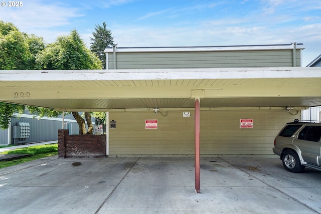 view of vehicle parking featuring a carport