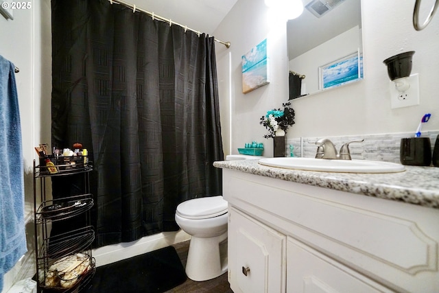 bathroom with vanity, a shower with curtain, and toilet