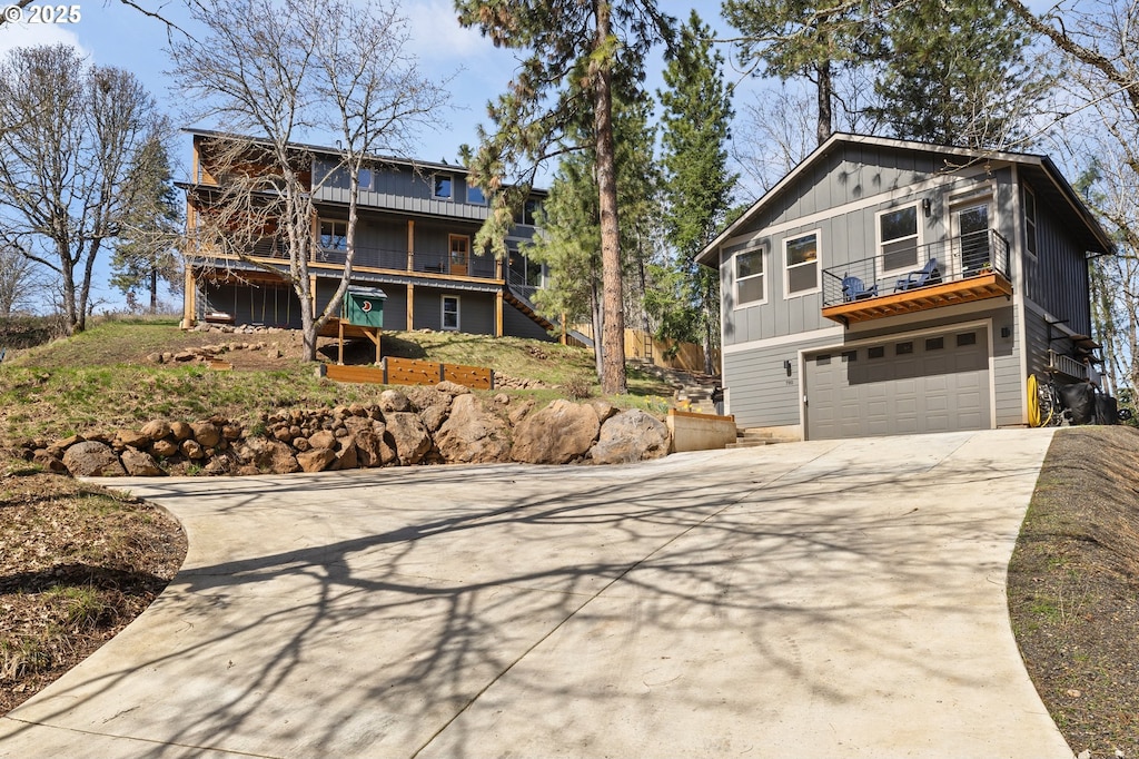 780 NW Michigan Ave, White Salmon, WA 98672 - view of front of home with an attached garage, driveway, and stairway