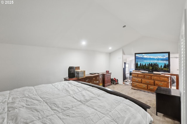 carpeted bedroom with vaulted ceiling