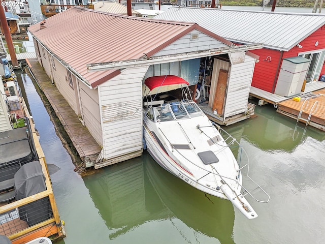 dock area with a water view and boat lift