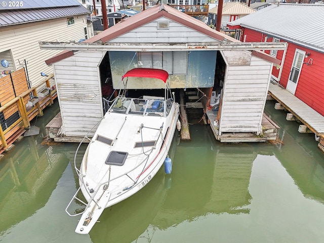 view of dock featuring boat lift and a water view