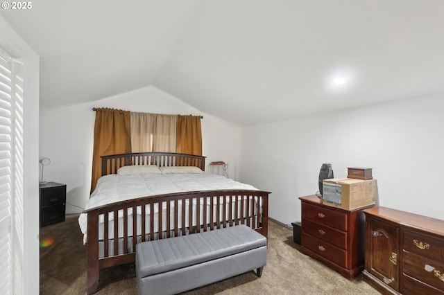bedroom featuring light carpet and vaulted ceiling