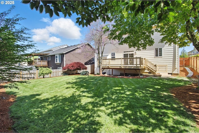 rear view of house featuring a wooden deck