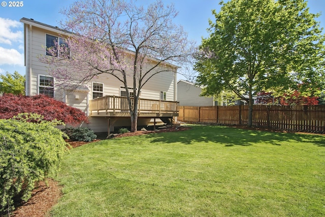 view of yard featuring a wooden deck
