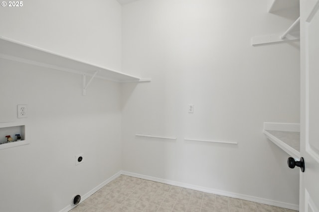 laundry area with hookup for a washing machine, electric dryer hookup, baseboards, and tile patterned floors