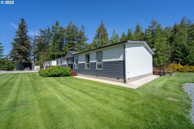 87477 Jean Dr, Bandon, OR 97411 - rear view of property featuring a carport, a yard, and crawl space