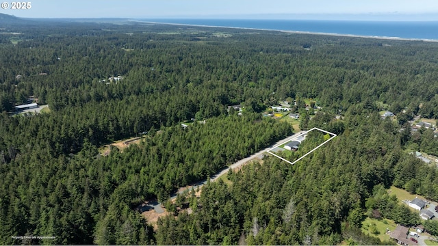 87477 Jean Dr, Bandon, OR 97411 - aerial view of property and surrounding area featuring a heavily wooded area and property boundaries highlighted