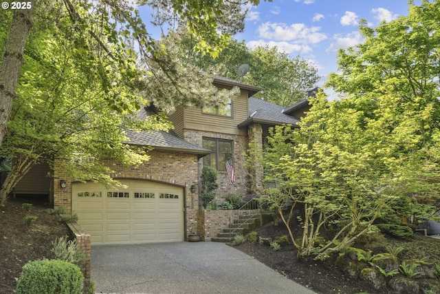 view of front of house with brick siding, asphalt driveway, a shingled roof, and a garage