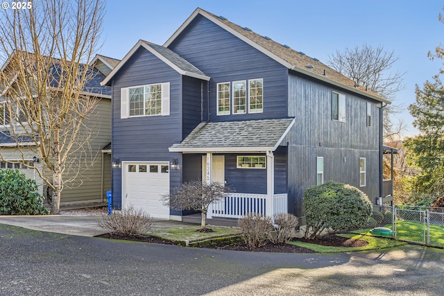 view of front of property featuring a porch and a garage