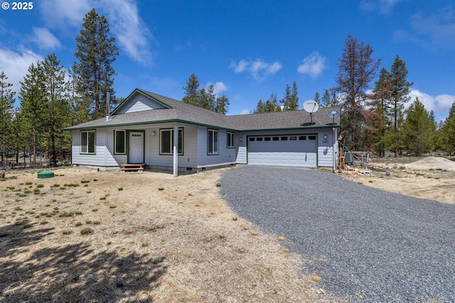 11421 Burlwood Dr, La Pine, OR 97739 - ranch-style house featuring gravel driveway and a garage