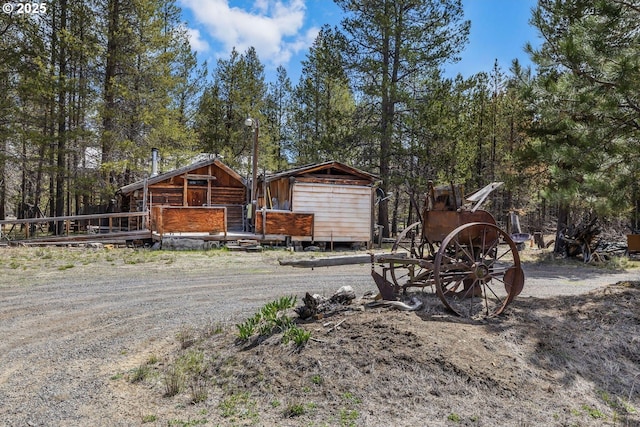 11421 Burlwood Dr, La Pine, OR 97739 - view of yard featuring a shed, an outdoor structure, and a deck