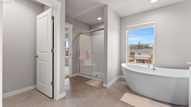 11649 SE Pleasant Valley Pkwy, Happy Valley, OR 97086 - bathroom featuring a shower stall, a freestanding bath, recessed lighting, and tile patterned flooring