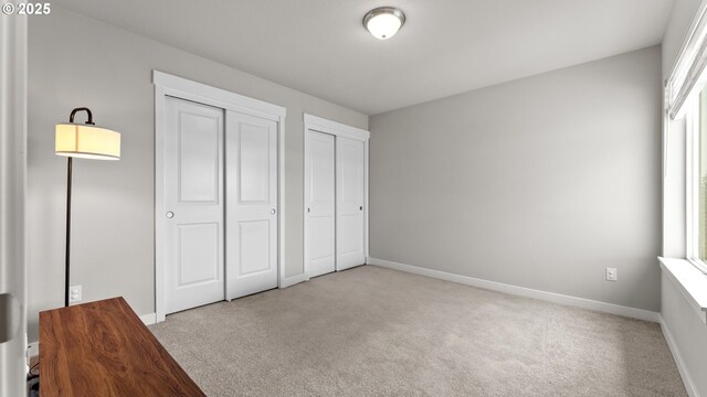11649 SE Pleasant Valley Pkwy, Happy Valley, OR 97086 - unfurnished bedroom with two closets and carpet