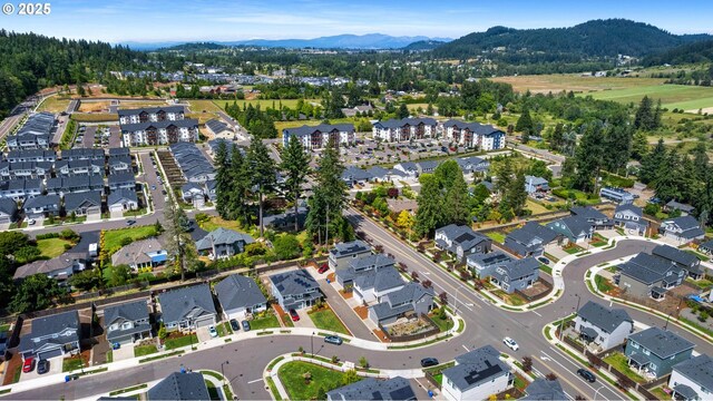 11649 SE Pleasant Valley Pkwy, Happy Valley, OR 97086 - aerial view of property's location featuring a mountainous background and nearby suburban area