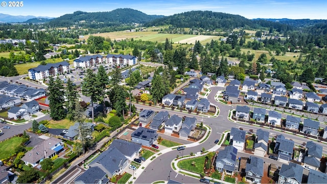 11649 SE Pleasant Valley Pkwy, Happy Valley, OR 97086 - aerial view of property and surrounding area with a mountainous background and nearby suburban area