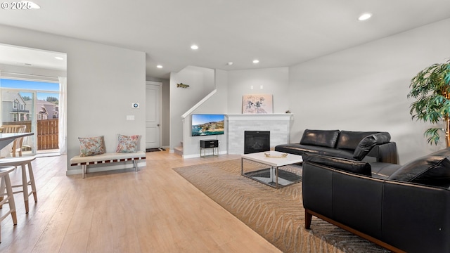 11649 SE Pleasant Valley Pkwy, Happy Valley, OR 97086 - living room featuring recessed lighting, light wood-type flooring, and a tile fireplace
