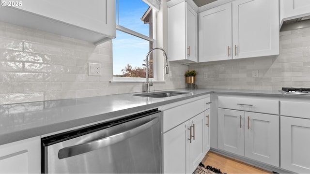 11649 SE Pleasant Valley Pkwy, Happy Valley, OR 97086 - kitchen featuring dishwasher, backsplash, white cabinets, and light countertops