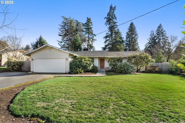 single story home featuring an attached garage, a front lawn, fence, and aphalt driveway