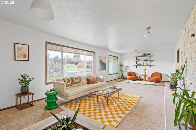 living room with baseboards and a textured ceiling