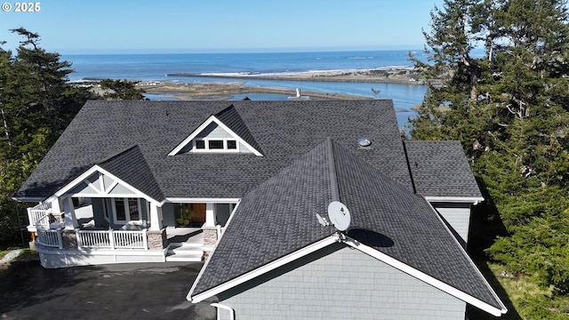 drone / aerial view with a water view