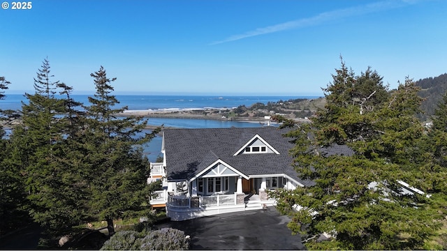 view of front facade with a water view