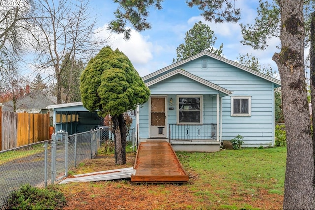 view of front of property featuring a front lawn, a porch, fence private yard, and a gate