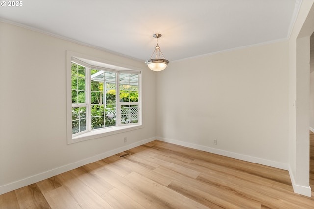 420 Mar Loop, Eugene, OR 97401 - spare room featuring baseboards, ornamental molding, and light wood-style floors