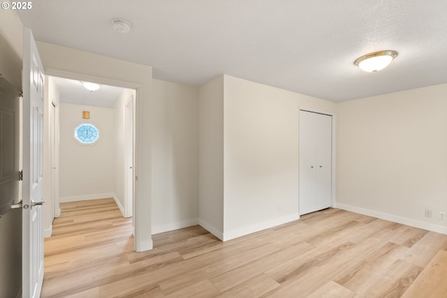 420 Mar Loop, Eugene, OR 97401 - spare room featuring light wood-style floors, a smoke detector, and baseboards