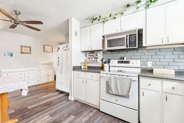 kitchen with decorative backsplash, a ceiling fan, wood finished floors, white cabinets, and white appliances
