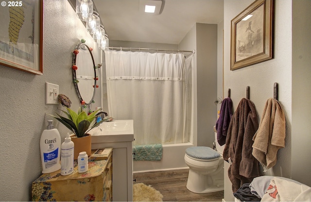 116 SE Williams Rd, Gresham, OR 97080 - bathroom featuring wood finished floors, vanity, and shower / bath combination with curtain