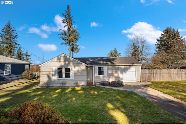 view of front of home featuring a garage and a front yard