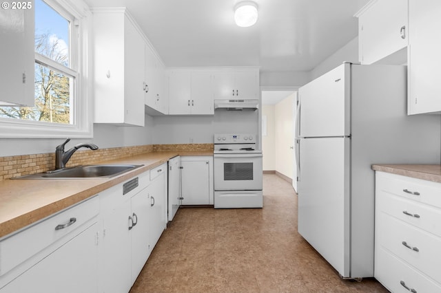 kitchen with white cabinetry, white appliances, sink, and backsplash