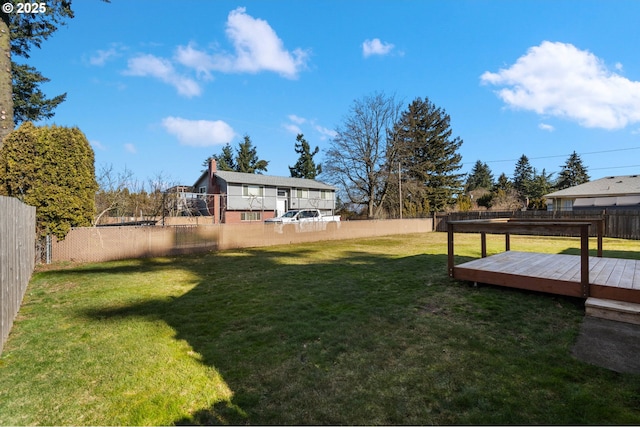 view of yard featuring a wooden deck