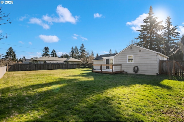 view of yard with a wooden deck