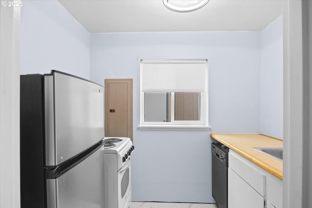 744 NE Craig St, Myrtle Creek, OR 97457 - kitchen featuring freestanding refrigerator, electric range, dishwasher, light countertops, and white cabinets