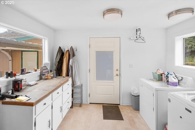 744 NE Craig St, Myrtle Creek, OR 97457 - laundry room with washing machine and clothes dryer, cabinet space, and light wood-style floors