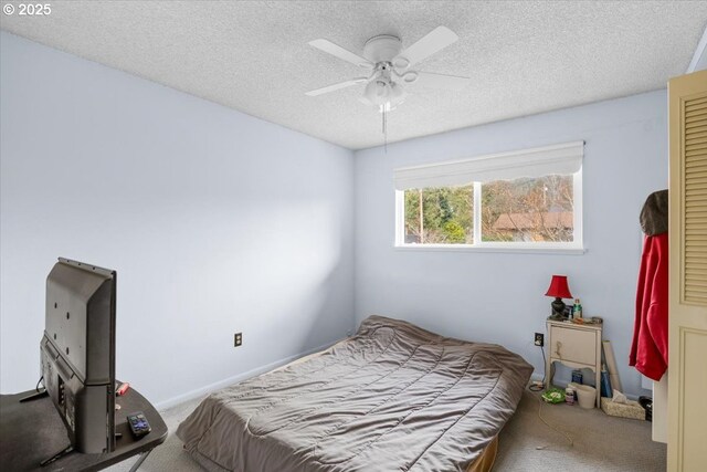 744 NE Craig St, Myrtle Creek, OR 97457 - bedroom with carpet flooring, a textured ceiling, and a ceiling fan
