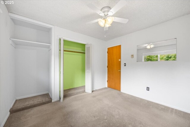 744 NE Craig St, Myrtle Creek, OR 97457 - unfurnished bedroom with carpet flooring, a closet, a textured ceiling, and ceiling fan