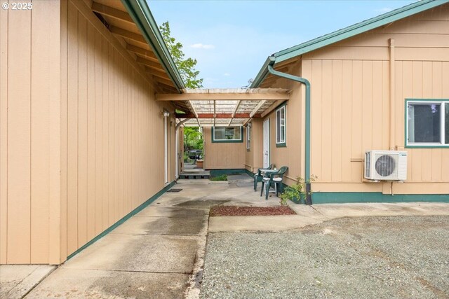 744 NE Craig St, Myrtle Creek, OR 97457 - view of side of home with ac unit and a patio area