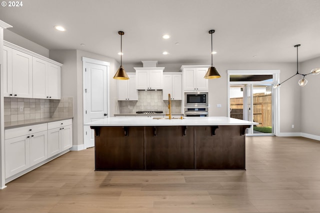 9238 N Incline Dr Unit Lt230, Camas, WA 98607 - kitchen featuring stainless steel appliances, light countertops, white cabinetry, tasteful backsplash, and recessed lighting