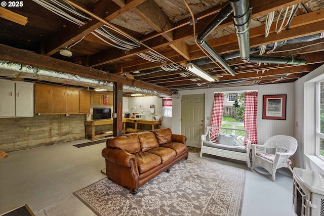 living area featuring finished concrete flooring