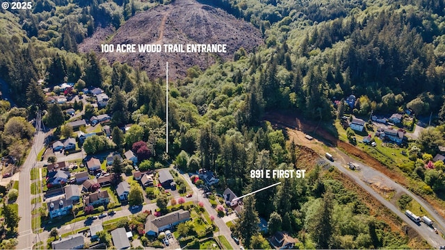 bird's eye view featuring a forest view