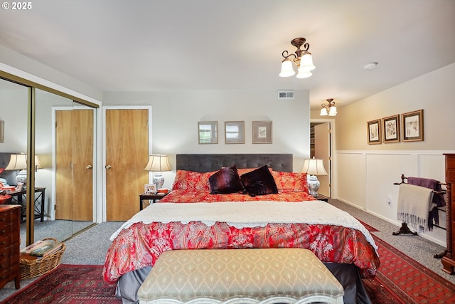 337 NW Hot Springs Alameda Rd, Stevenson, WA 98648 - bedroom featuring carpet flooring, wainscoting, and two closets