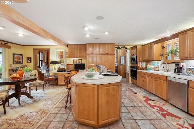 337 NW Hot Springs Alameda Rd, Stevenson, WA 98648 - kitchen featuring appliances with stainless steel finishes, a sink, healthy amount of natural light, light countertops, and ornamental molding