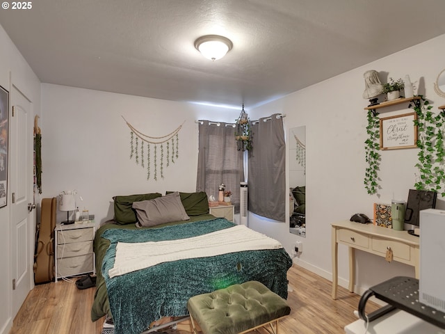 bedroom featuring hardwood / wood-style flooring