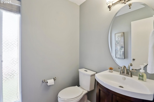 bathroom with toilet and vanity